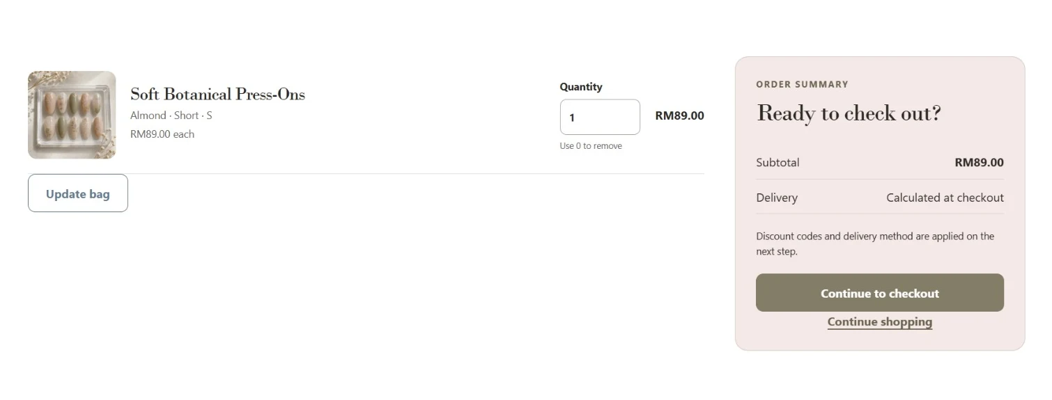 Press-on nail product in a shopping bag with quantity and order summary.